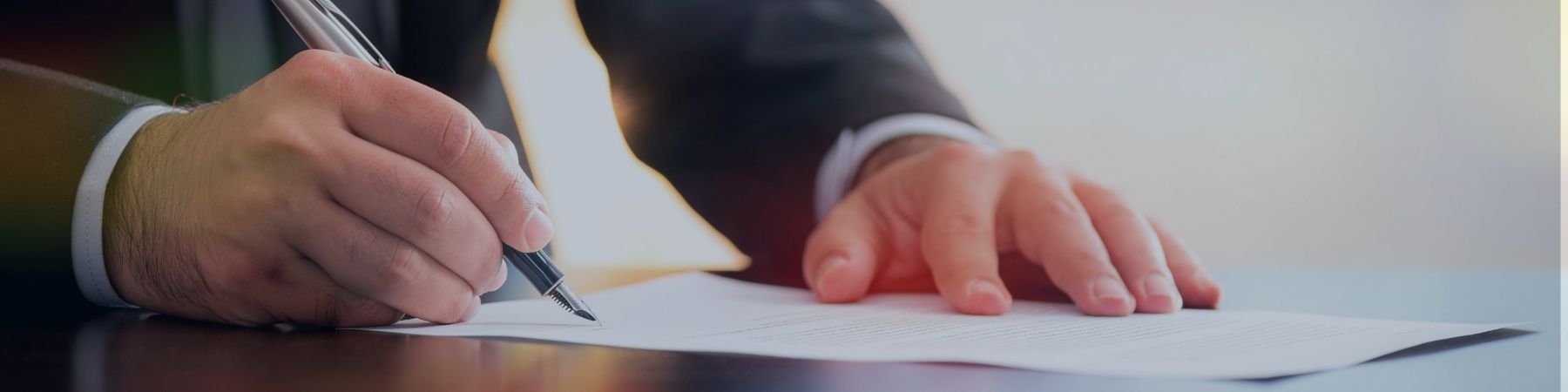 Person signing paper